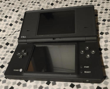 Matte black clamshell-hinged rectangles, with a screen set in each. Buttons surround the bottom screen.