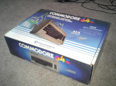 A large, low box, with a full color picture of the computer printed on it, and a blue and white background