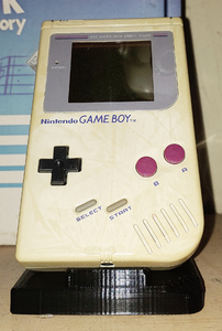 A small off-white slab with a screen and buttons. The plastic is somewhat yellowed and mottled.