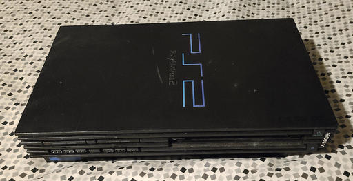 Black slab with ridged sides and stylized PS2 logo.