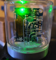 Close up of a circuit board in a glass tube.
