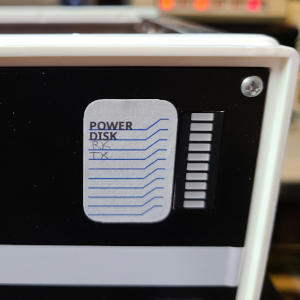 Close up of an LED bargraph and a label. The label reads from top to bottom: 'Power', 'Disk', 'TX', 'RX'. 'TX' and 'RX' are written in pencil.