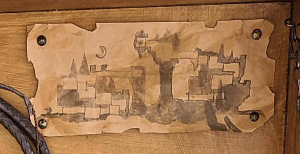 A worn paper map of a castle.
